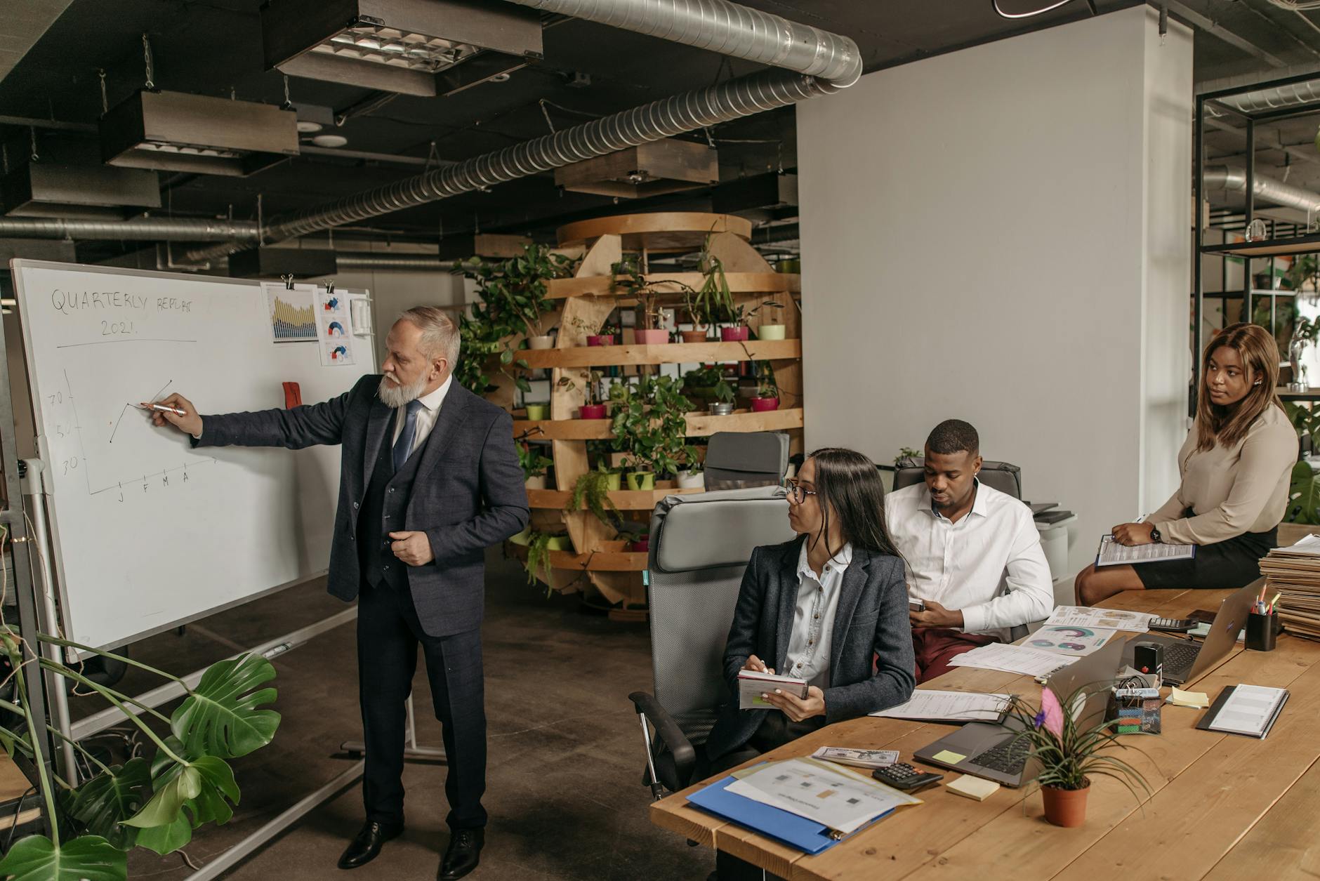 four people working in the office