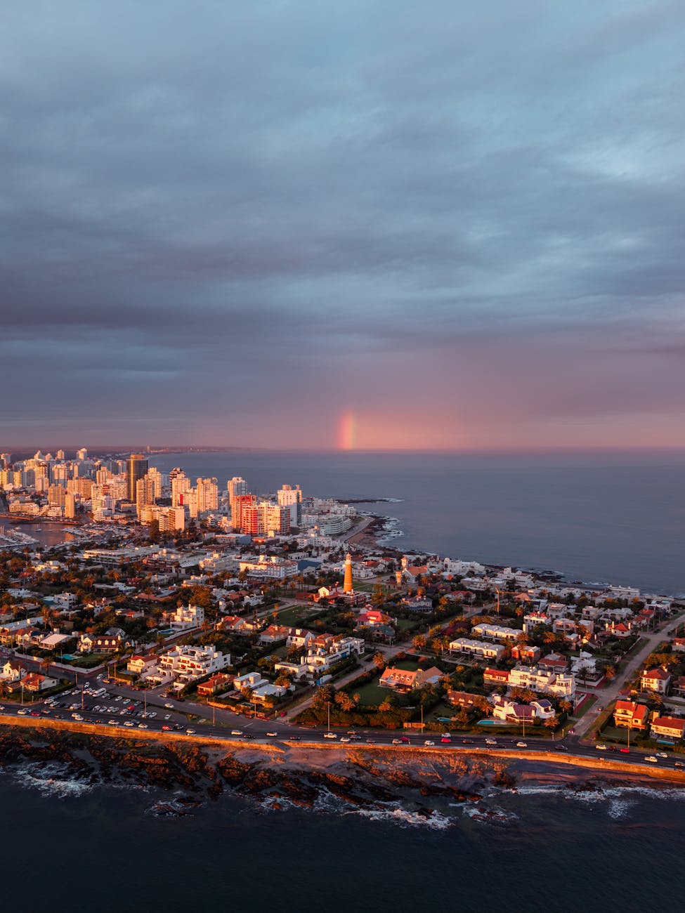 aerial view of punta del este at sunset with rainbow